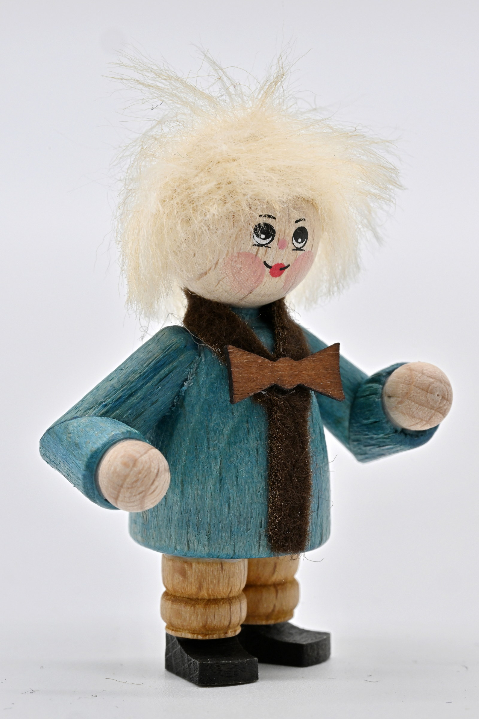 Figur, Kind mit Ohrenschützern H 5 cm