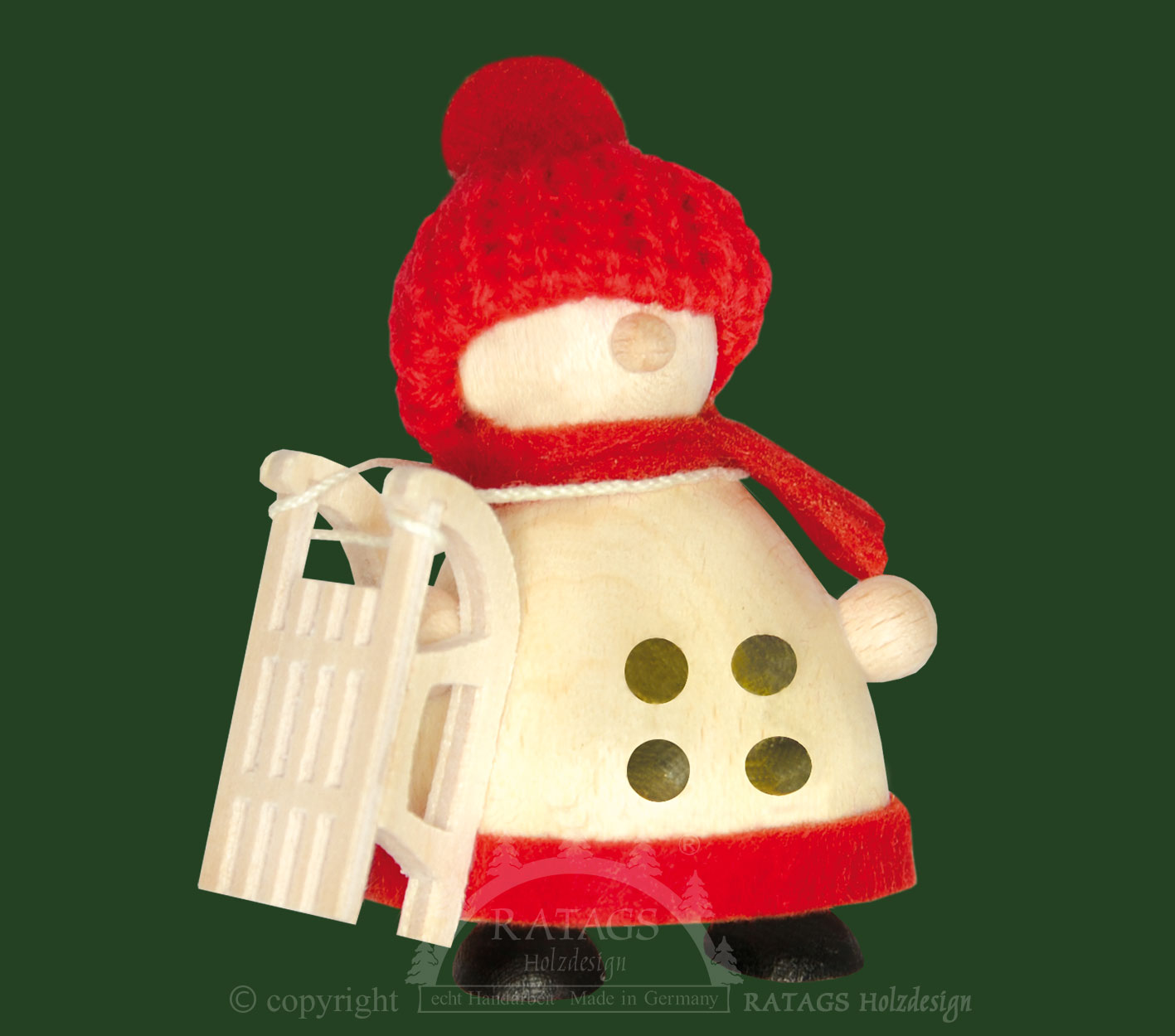 Snow-Molli mit Schlitten, rote Strickmütze