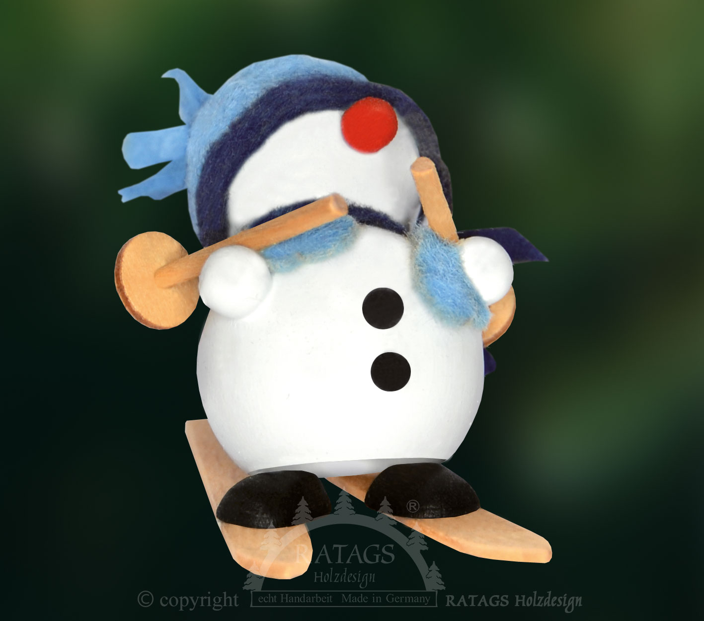 Schneemann auf Ski, blaue Mütze