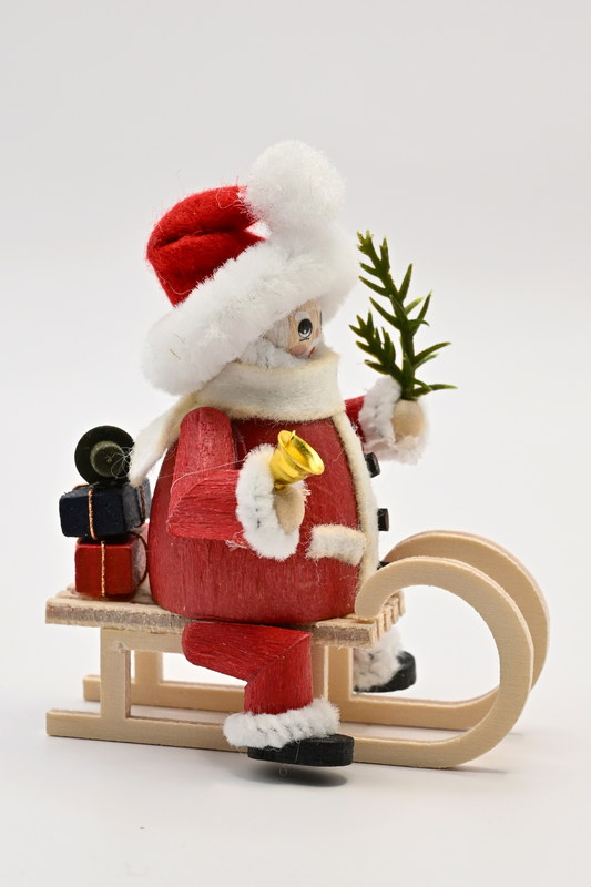 Figur, Weihnachtsmann auf Schlitten, rot
